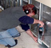 We begin our installation process by replacing the bottom of the wood studs with metal studs.