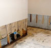 Once the drywall has been cut away and all other damaged wood studs and insulation have been removed, the restoration process can begin.